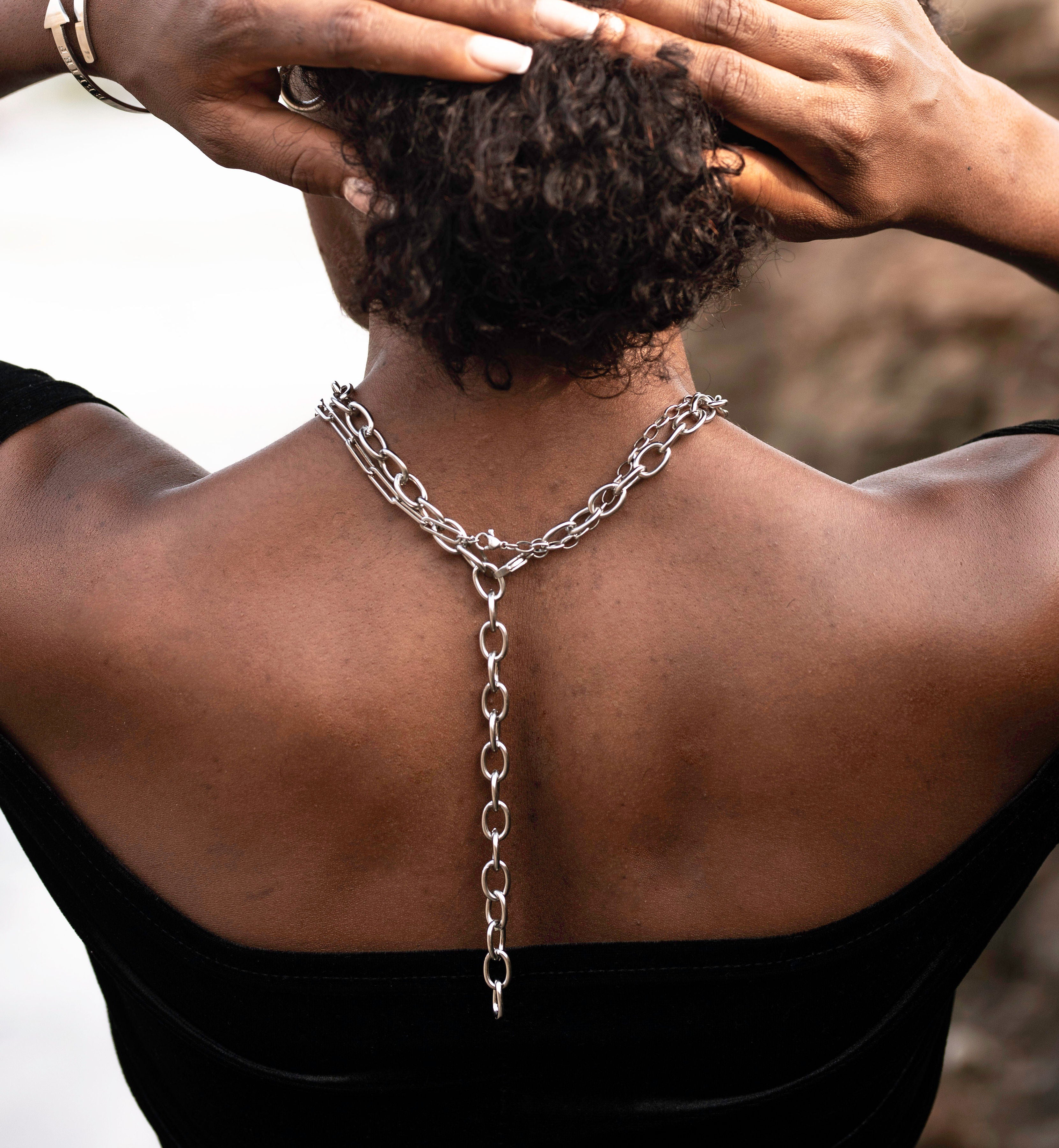Female wearing chunky padlock affirmations silver necklace stacked with the believe in yourself chunky necklace 